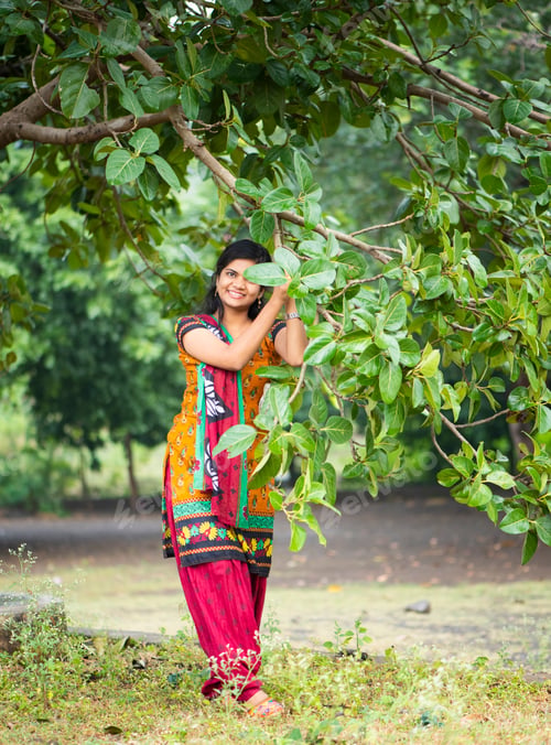 Preview: Beautiful girl between nature full of branches of tree.