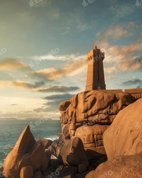 Preview: Ploumanach lighthouse sunset in pink granite coast, Brittany, France.