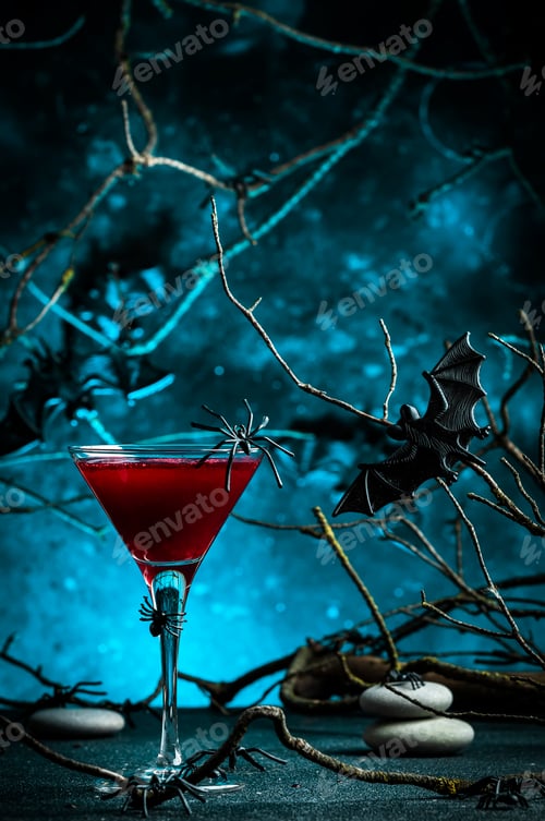 Preview: Halloween cocktail bloody martini with syringe on scary dark blue background wi