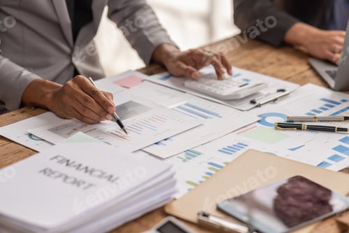 Preview: Group of confident business people point to graphs and charts to analyze market data, balance sheet,