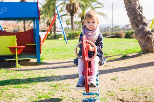 Preview: Active little girl on playground