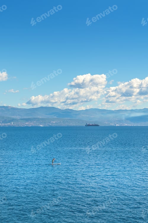 Preview: Unrecognizable person stand-up paddle boarding at Adriatic sea Kvarner gulf