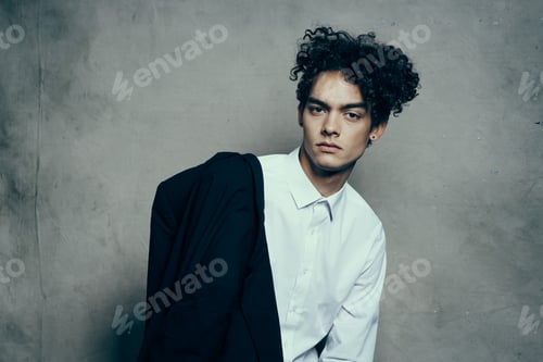 Preview: fashionable curly bob in glasses with a jacket on the shoulder close-up portrait