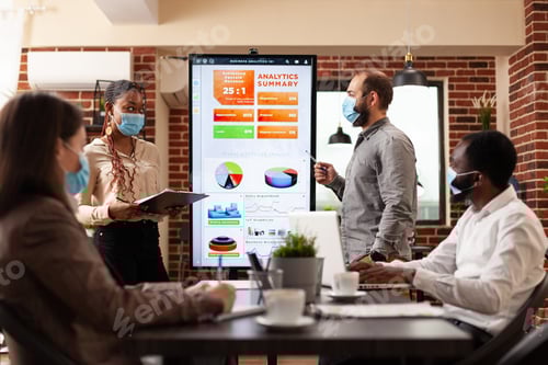 Preview: Team Discussing Business Analytics in Modern Office