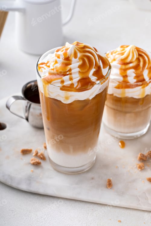 Preview: Iced caramel latte topped with whipped cream and caramel sauce