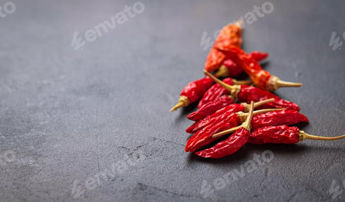 Preview: Red hot chili peppers on rusty background