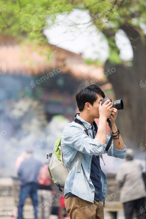 Preview: Young man taking pictures in the Lama Temple