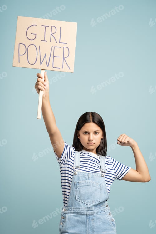Preview: Teen Girl Holds Up Girl Power Sign