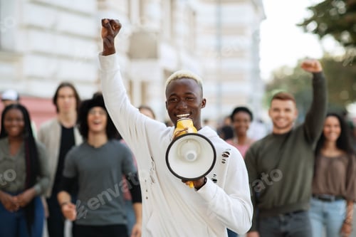 Preview: Emotional black guy activist with megaphone on the street