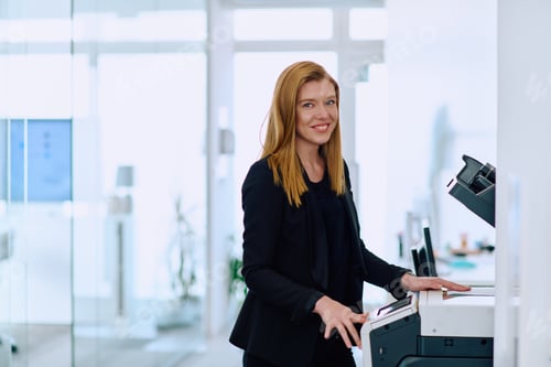 Preview: Blonde Businesswoman Using Printer in Office Setting.