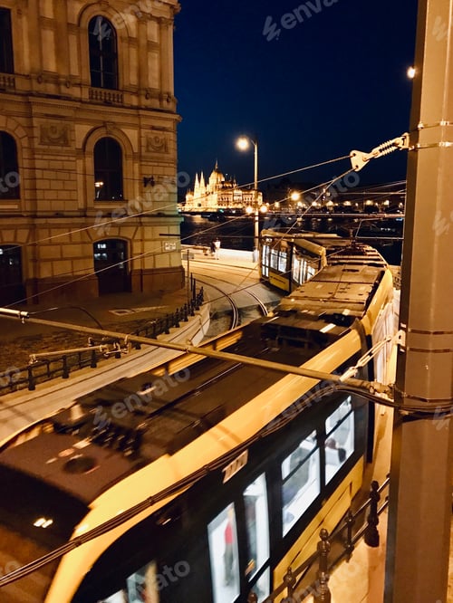 Preview: Tramway at night in Budapest with the Parliament in the background.