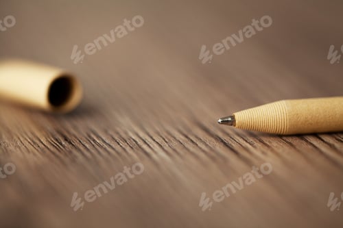 Preview: Photo of ballpoint pen on wood desk
