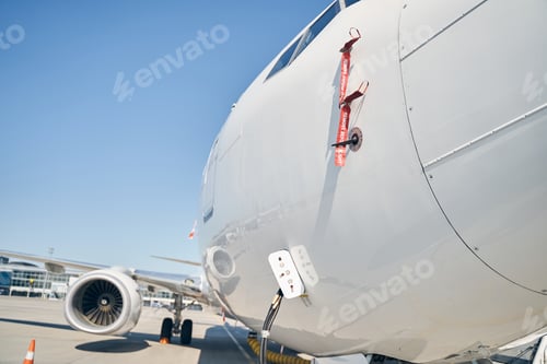Preview: Landed airliner being serviced at an airport