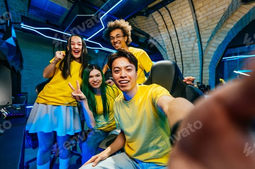 Preview: Multiethnic group of young friends playing videogames