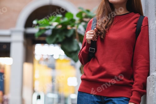 Preview: Closeup of a young woman walking on the street while traveling and sightseeing around the city