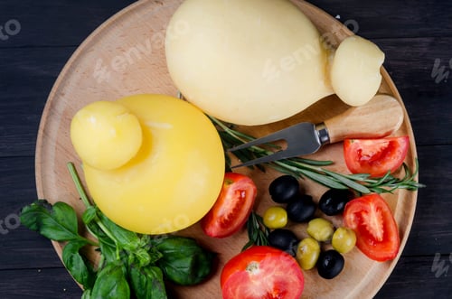 Preview: Traditional italian cheese Caciocavallo, homemade cheesy Pasta filata with vegetables