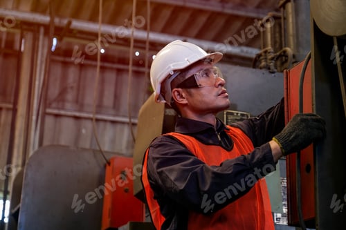 Preview: Portrait of asian engineer worker or technician works with machine in factory workplace