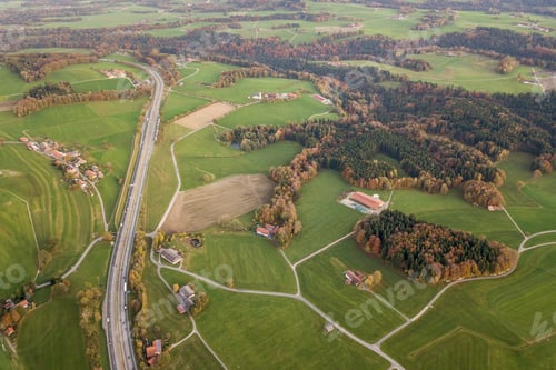 Preview: Aerial view of small scattered farm houses with red tiled roofs