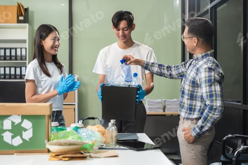 Preview: Business people working examining waste recyclable separation divided bin in the office