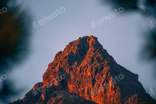 Preview: Steep hill illuminated by a vibrant orange light, Nevado de Colima National Park
