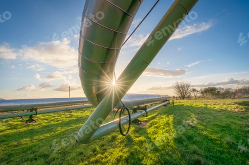 Preview: Geothermal energy. Pipelines of a plant at sunset in Larderello, Tuscany region, Italy