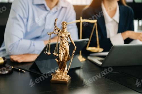 Preview: Business and lawyers discussing contract papers with brass scale on desk in office. Law, legal