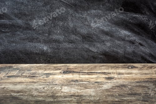 Preview: Empty wooden table with chalkboard background for displaying products