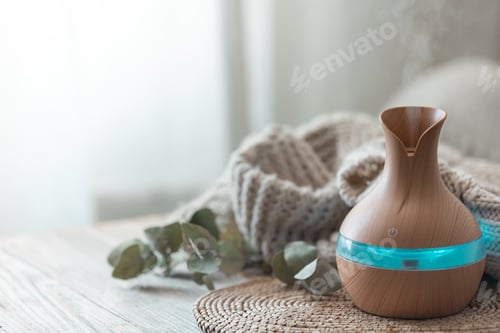 Preview: Spa composition with aroma oil diffuser lamp on a blurred background.