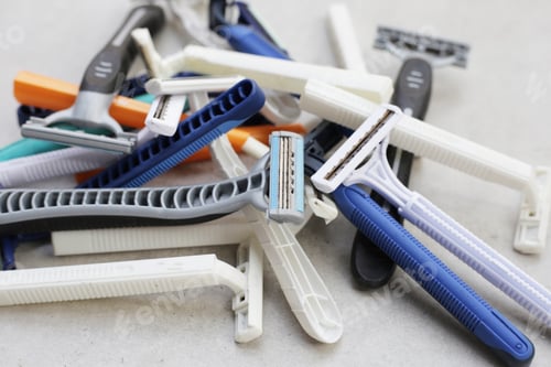 Preview: Used razor waste on grey background.