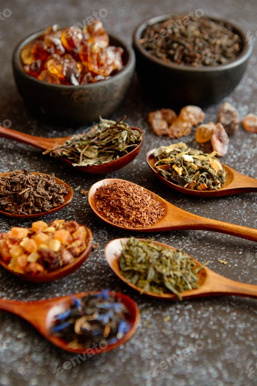 Preview: Spoons with different types of dry tea leaves.