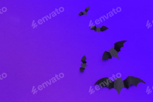 Preview: halloween and decoration concept - paper bats flying
