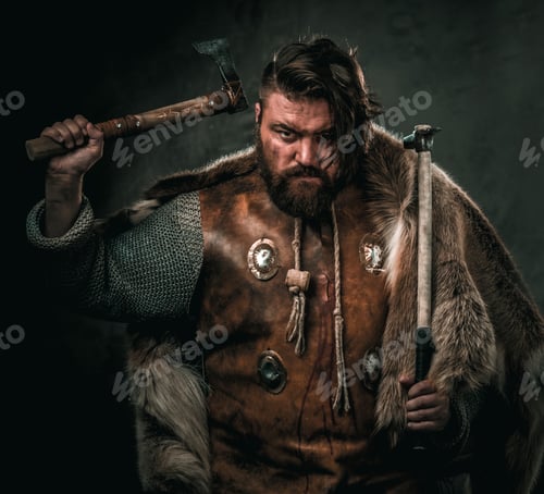 Preview: Viking with cold weapon in a traditional warrior clothes