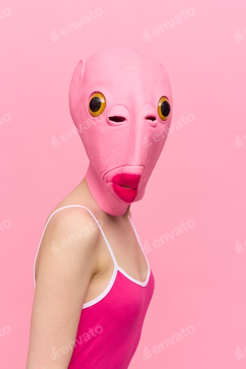 Preview: Modern Halloween costume in a silicone mask in the shape of a pink fish head in a sexy costume. The