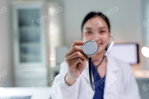 Preview: Asian doctor holding stethoscope doing medical examination