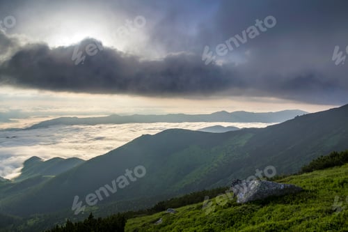 Preview: Fantastic view of mountain valley covered with low white puffy like snow clouds