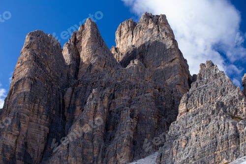 Preview: Low angle shot of the rocks in the Italian Alps under the sky