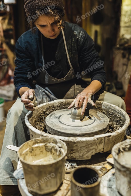 Preview: student in pottery workshop makes craft from clay