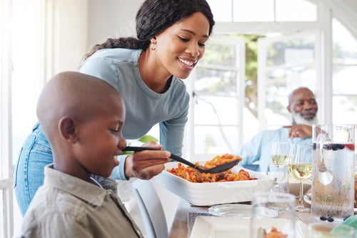 Preview: A loving family can be any family. Shot of a mother dishing food for her son at home.
