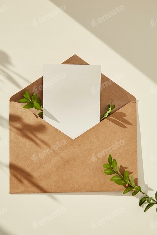 Preview: Open envelope stationery card mockup invitation,blank greeting card and green leaves under shadows
