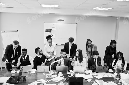 Preview: Multiracial young creative people in modern office