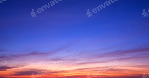Preview: Colorful twilight sky background with streak clouds on beautiful dusk sky after sundown