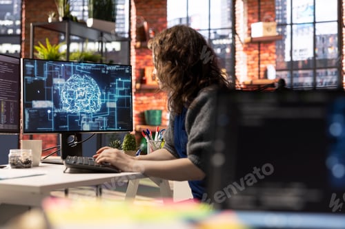 Preview: Teleworking developer using computer for artificial intelligence computing