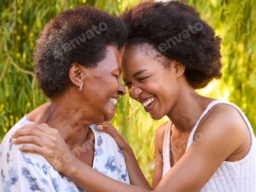 Preview: Multi-Generation Family With Senior Mother And Adult Daughter Laughing In Garden Together