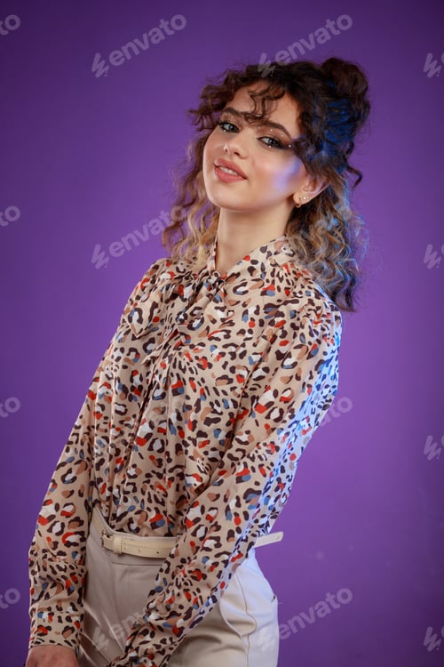 Preview: Vertical photo of young curly-haired girl smiling to the camera