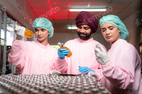 Preview: Team worker quality control a fruit drink factory in glass bottles Inspecting glass.