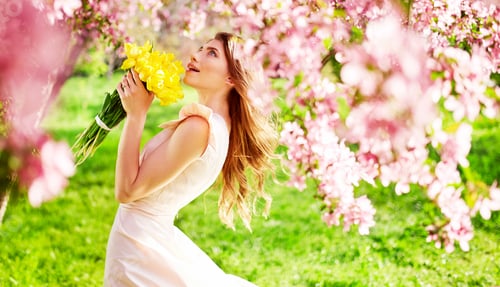 Preview: Spring Style. Beautiful Young Brunette Woman In Nice Spring Dress With A Bouquet Of Tulips.