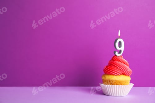 Preview: Birthday cupcake with number nine candle on violet background, space for text