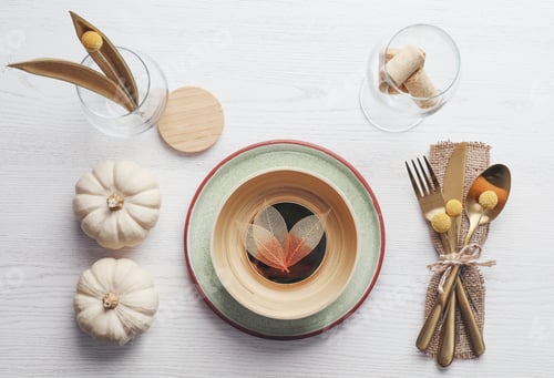 Preview: Autumn table setting with pumpkins on white wooden background, flat lay