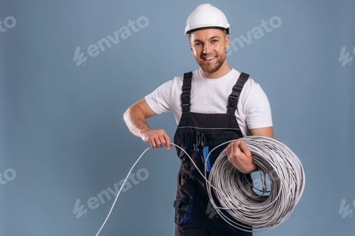 Preview: Providing the internet connection, guy in hardhat. Handsome man is against background