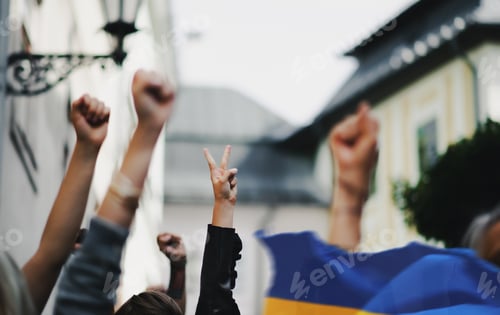 Preview: Arms and fists raised in the air, protest against Russian military invasion in Ukraine